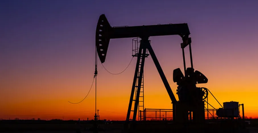 Oil pump jack field sunset